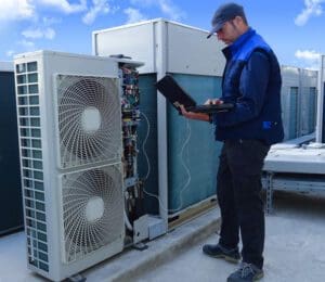 Heating contractor working on rooftop unit
